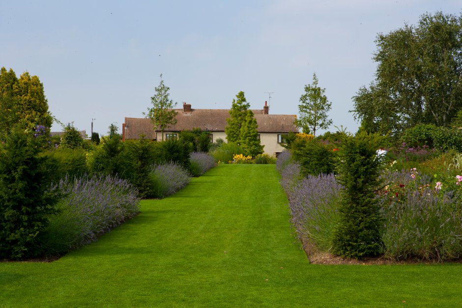 Crisp lawn edges, like these at RHS Garden Hyde Hall, help define borders