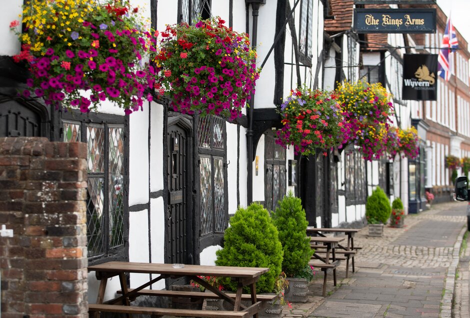 Traditional summer hanging baskets brightening up a street in Amersham